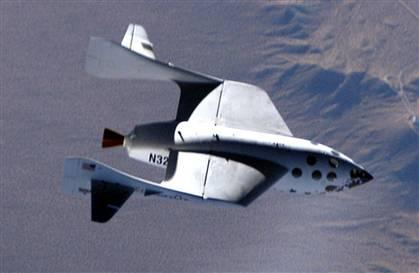 The SpaceShipOne rocket plane, shown in this photo from its first supersonic flight test, is due to make its first true spaceflight June 21. (Photo courtesy of Scaled Composites.)
