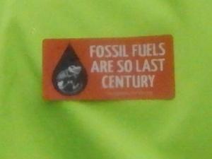Fossil Fuels Are So Last Century. (This was stuck on the back of a guy's jacket.)