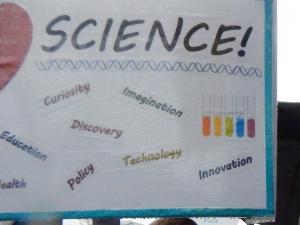 Science! Education. Health. Curiosity. Policy. Discovery. Imagination. Technology. Innovation. (The other side of Dr. Jean Cook's sign.)